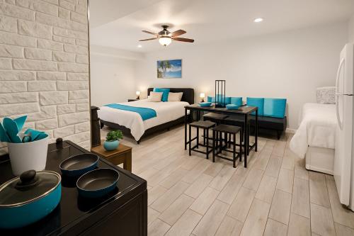 a hotel room with a bed and a desk with a table at Hot Tub WiFi Gym Firepit Kitchen in Kernersville