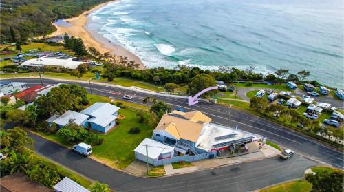 an aerial view of a town with a beach at Bonny View Paradise in Bonny Hills