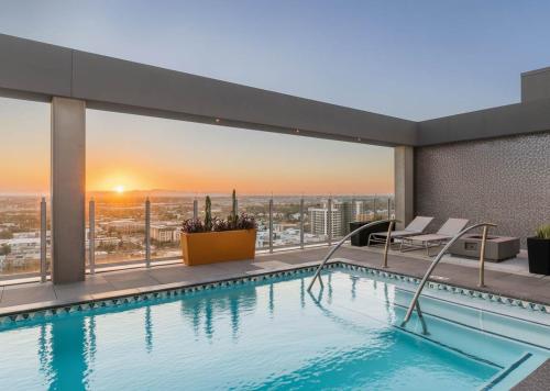 a swimming pool on top of a building with a view at Boulevard Stays Downtown Highrise STU Sky Pool Parking Gym 15 in Phoenix