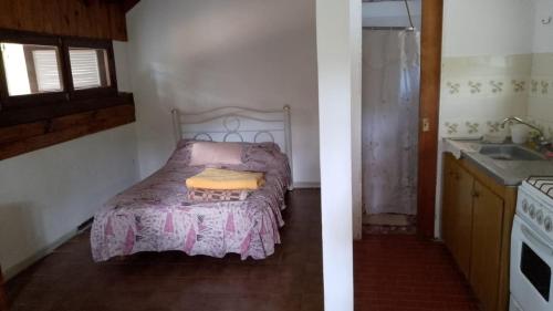 two images of a bedroom with a bed and a sink at Okin 9 cristina in Costa del Este