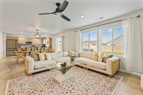 a living room with a couch and a table at 6BR Retreat with Playground Basketball & Sleeps 22 in Star