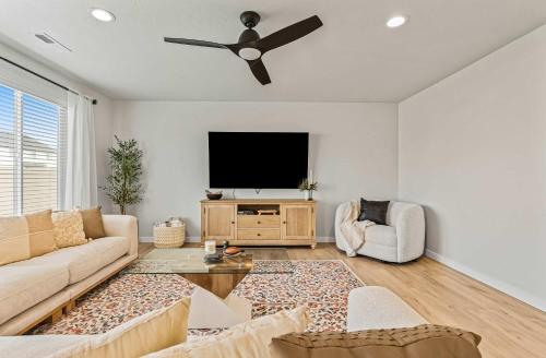 a living room with a couch and a tv at 6BR Retreat with Playground Basketball & Sleeps 22 in Star