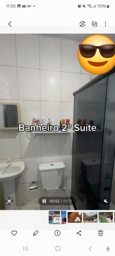 a picture of a bathroom with a smiley face on the window at Suite confortável prox a COP 30 in Belém