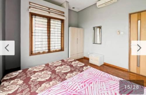 Ένα ή περισσότερα κρεβάτια σε δωμάτιο στο Newly Large Villa 3BR Dago Bandung by 2ndHome