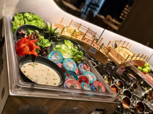 a refrigerator filled with different types of food at Citadines Connect Bertam Georgetown Penang in George Town