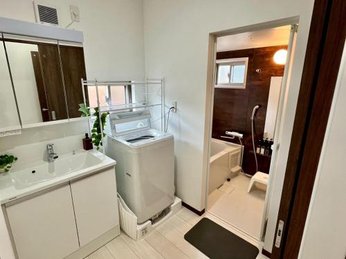 Ένα μπάνιο στο Value Residence Hotel 久貝