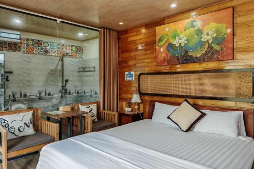 a bedroom with a bed and a bath tub at Ninh Binh Peaceful Retreat in Ninh Binh