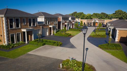 a row of houses in a residential neighborhood at Mansi on Raymond in Sale