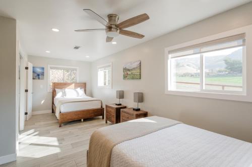 a bedroom with two beds and a ceiling fan at Dennison House in Three Rivers