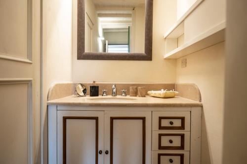 a bathroom with a sink and a mirror at Casale Greppobello in Perugia