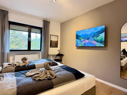 Ένα ή περισσότερα κρεβάτια σε δωμάτιο στο KO 3-Zimmer Apartment 73 qm bis zu 6 Personen