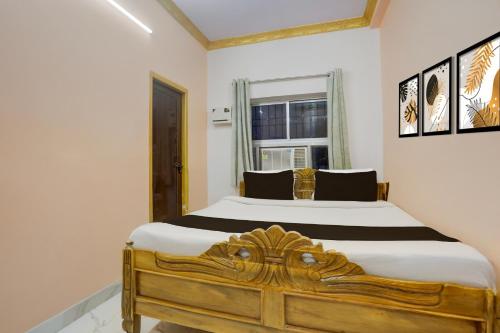 Ένα ή περισσότερα κρεβάτια σε δωμάτιο στο Super Hotel O Patliputra Golambar