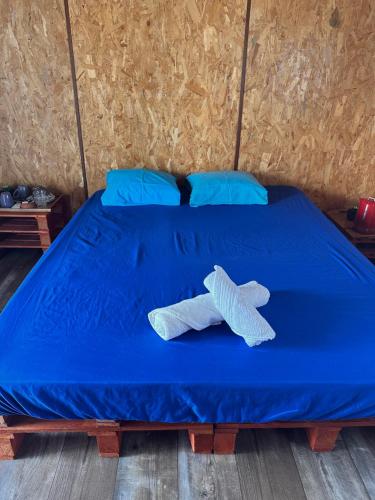 Llit o llits en una habitació de Studio Karenga