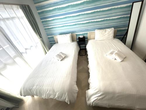 A bed or beds in a room at Rapport Kukomae 206