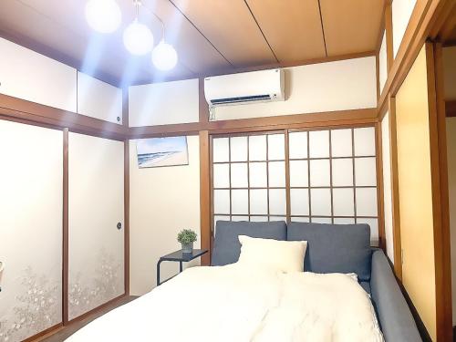 Ένα ή περισσότερα κρεβάτια σε δωμάτιο στο Usami Seaside