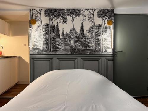 Postel nebo postele na pokoji v ubytování L'absinthe au coeur de Metz