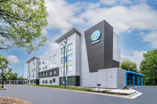 an office building with the intel logo on it at Tru By Hilton Commerce in Commerce