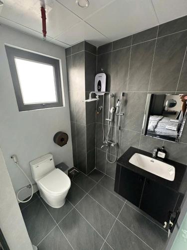 a bathroom with a toilet and a sink at Dalat Family Center in Da Lat