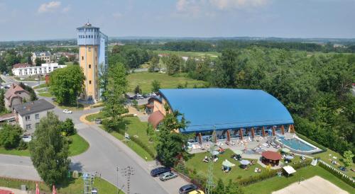 an overhead view of a building with a blue roof at Penzion ve věži in Bohumín