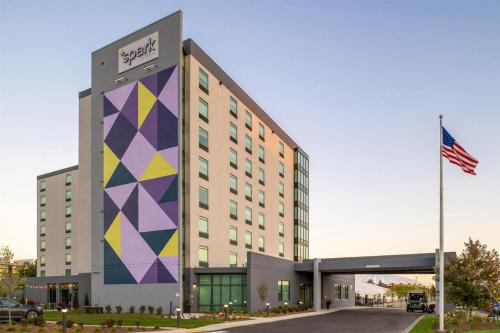 a rendering of a hotel with a colorful building at Spark By Hilton Madison Central in Madison