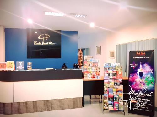 a store with a blue wall and a counter at Krabi Grand Place Hotel in Ban Khlong Chi Lat