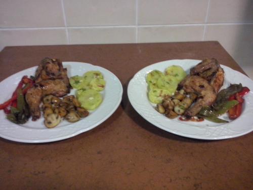 two white plates of food on a table at La Contrada in Arens de Lledó