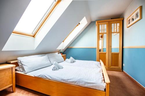 Postel nebo postele na pokoji v ubytování Aparthotel CITY