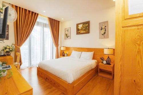 Postel nebo postele na pokoji v ubytování MIM Homestay