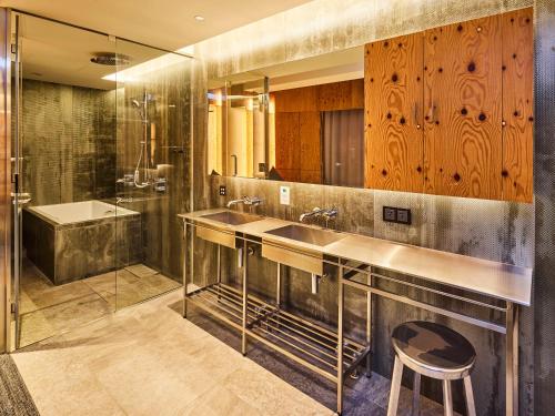 a bathroom with two sinks and a shower at ONE@Tokyo in Tokyo