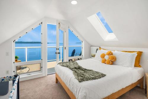 a bedroom with a bed with a view of the ocean at Water View Retreat Near Beach Park & City in Redondo