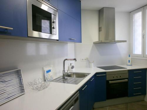 Kuchyň nebo kuchyňský kout v ubytování La Siesta Apartamentos