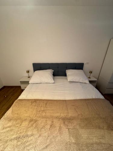 Ένα ή περισσότερα κρεβάτια σε δωμάτιο στο PRV Apartments