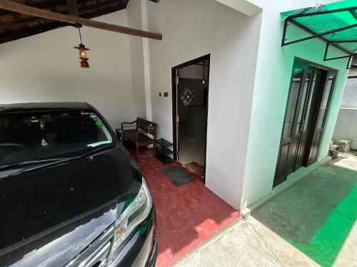 a car parked in front of a house at MJ Villa Ahangama in Ahangama