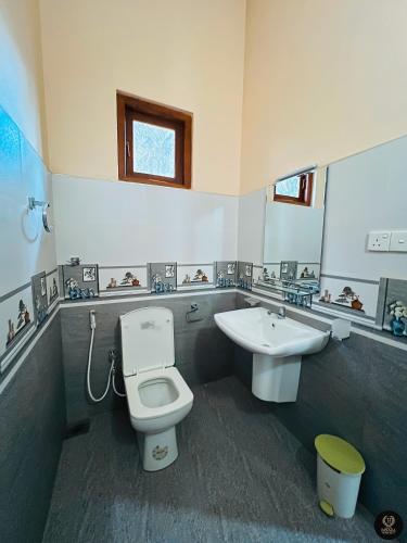 a bathroom with a toilet and a sink at Binara Home Stay in Polonnaruwa
