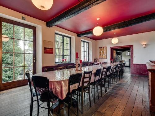 a large dining room with a long table and chairs at Group Stay with Spa in Vielsalm in Vielsalm