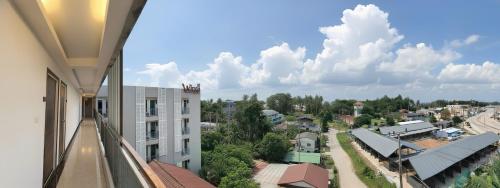 a view of a city from the balcony of a building at The Wings Boutique Hotels Krabi Ko Lanta in Ko Lanta