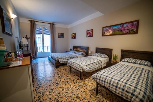 Ένα ή περισσότερα κρεβάτια σε δωμάτιο στο Affittacamere Al Passatore
