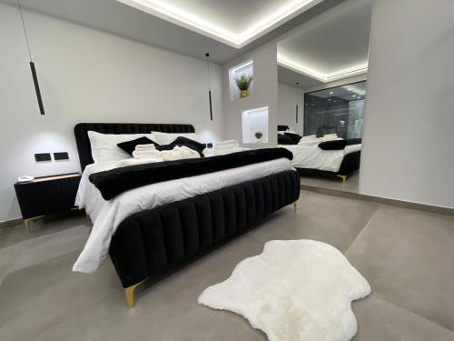 Postel nebo postele na pokoji v ubytování Coco Noir Luxury Villa