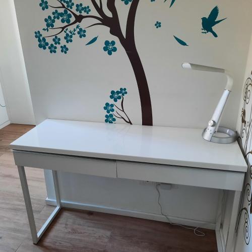 a tree with flowers and birds stenciled on a wall at Wellness at home in Ancona