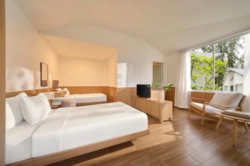 Postel nebo postele na pokoji v ubytování Palace Long Hai Resort