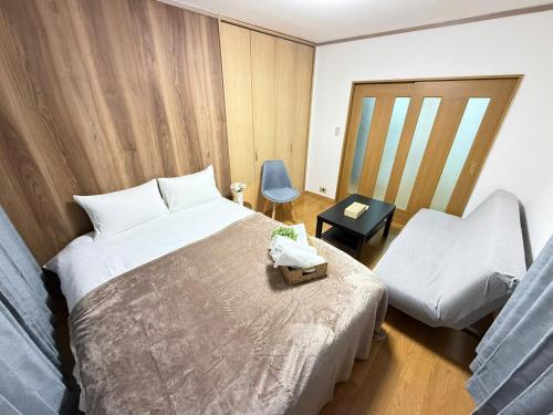 Кровать или кровати в номере Shinjuku Area 302 Shinjuku Apartment