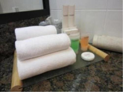 a counter with three rolls of paper towels on it at Tanahmas The Sibu Hotel in Sibu