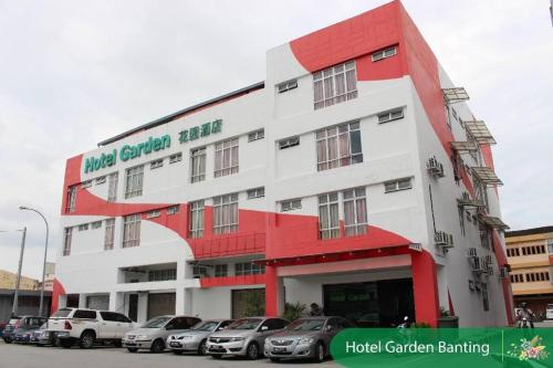 a building with cars parked in front of it at THE GARDEN HOTEL (BANTING) SDN. BHD. in Banting