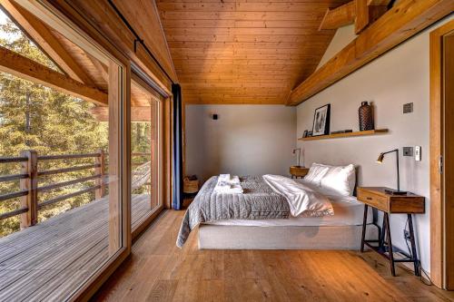 Ένα ή περισσότερα κρεβάτια σε δωμάτιο στο Chalet Panaga