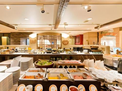 a buffet line with many different types of food at Hotel Castle Plaza in Hayashi