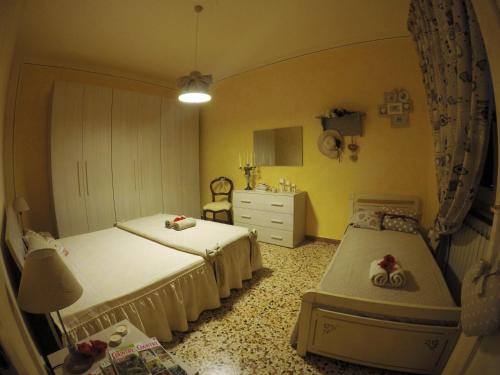 Tempat tidur dalam kamar di Casa vacanze il Redo