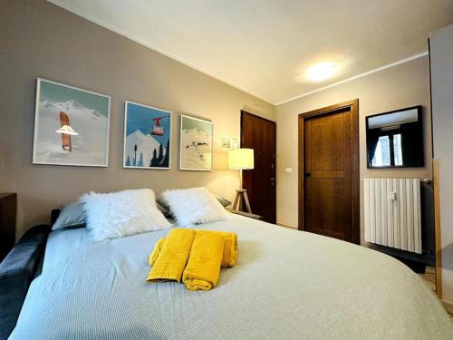 Postel nebo postele na pokoji v ubytování Bardonecchia Bliss