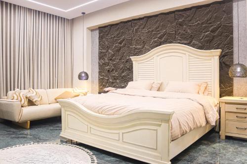 Ένα ή περισσότερα κρεβάτια σε δωμάτιο στο احسان للشقق المفروشة