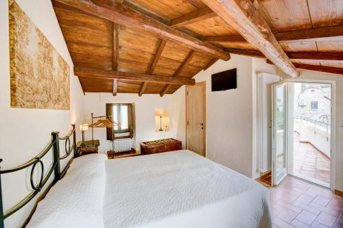 a bedroom with a bed and a large window at La Casa di Ele in Matera