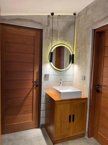 a bathroom with a sink and a mirror at Flex Living Canggu in Canggu